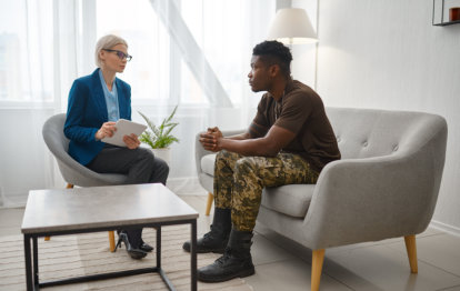 young man listening to psychiatrist