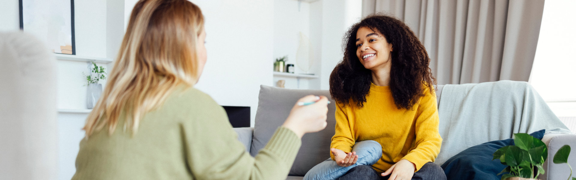 young woman smiling to psychiatrist